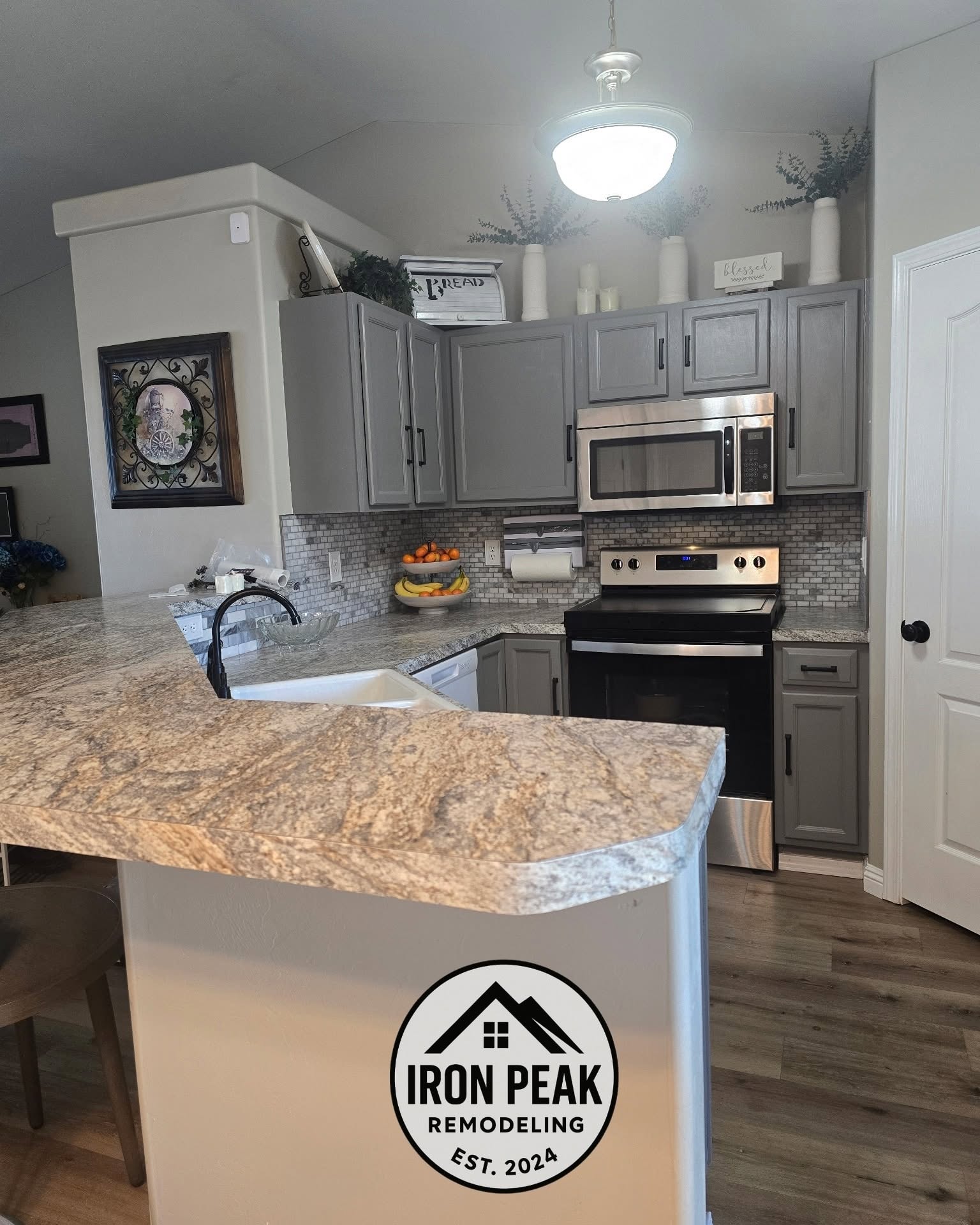 Gray kitchen remodel with stone countertops